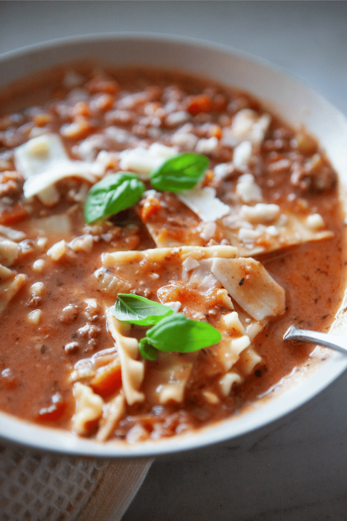 Close up of easy lasagna soup with lasagna noodles.