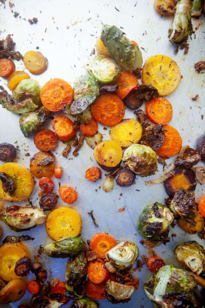 Carrots, brussels sprouts and shallots roasted on sheet pan.