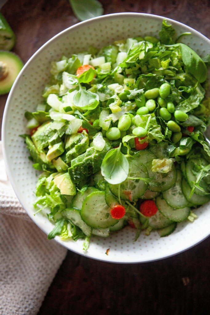 House salad mixed together in large bowl.