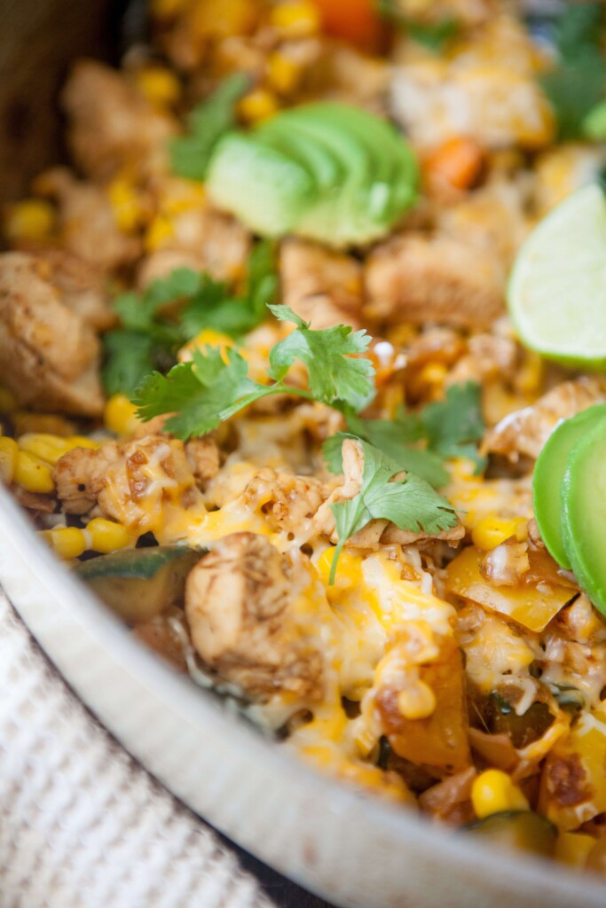 Zucchini, corn and chicken skillet topped with fresh cilantro in skillet.