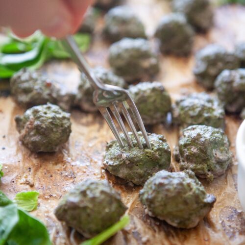 Close-up of baked spinach basil meatballs made with lean ground beef and cottage cheese
